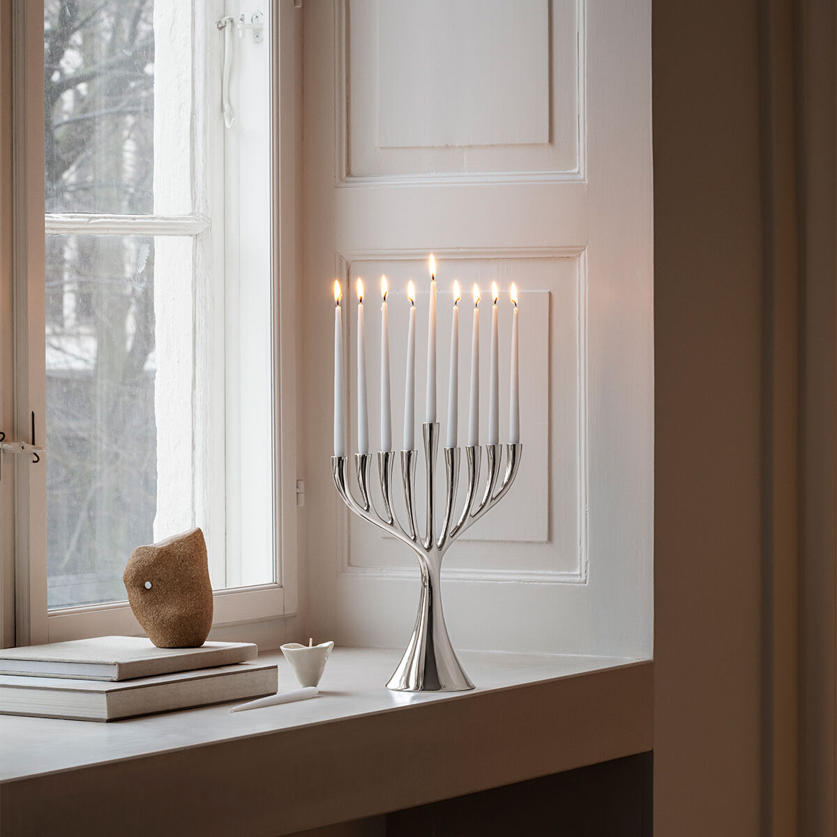COBRA Menorah in stainless steel.