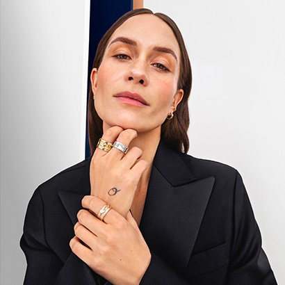 rings in 18 karat yellow white and rose gold with diamonds on hands from the fusion cloud collection by georg jensen