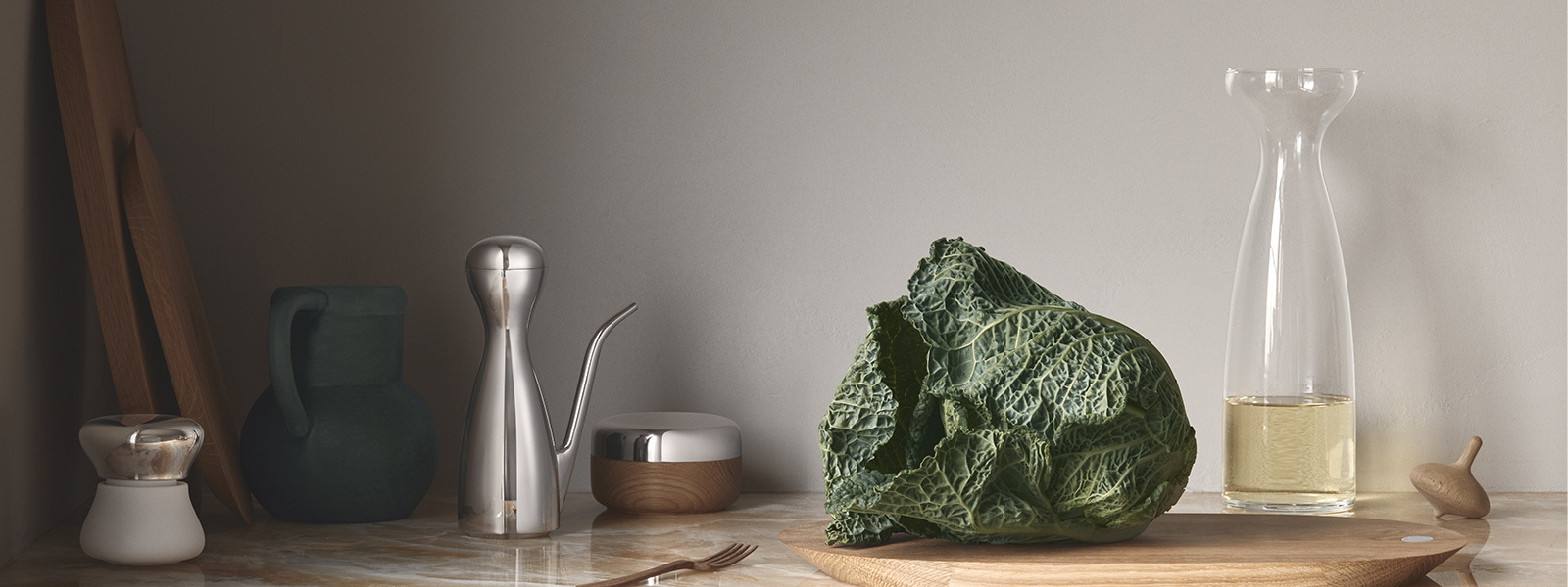 salt jar oil can mortar in stainless steel and glass carafe and oak cutting board from the Alfredo collection designed by Alfredo Häberli for Georg Jensen