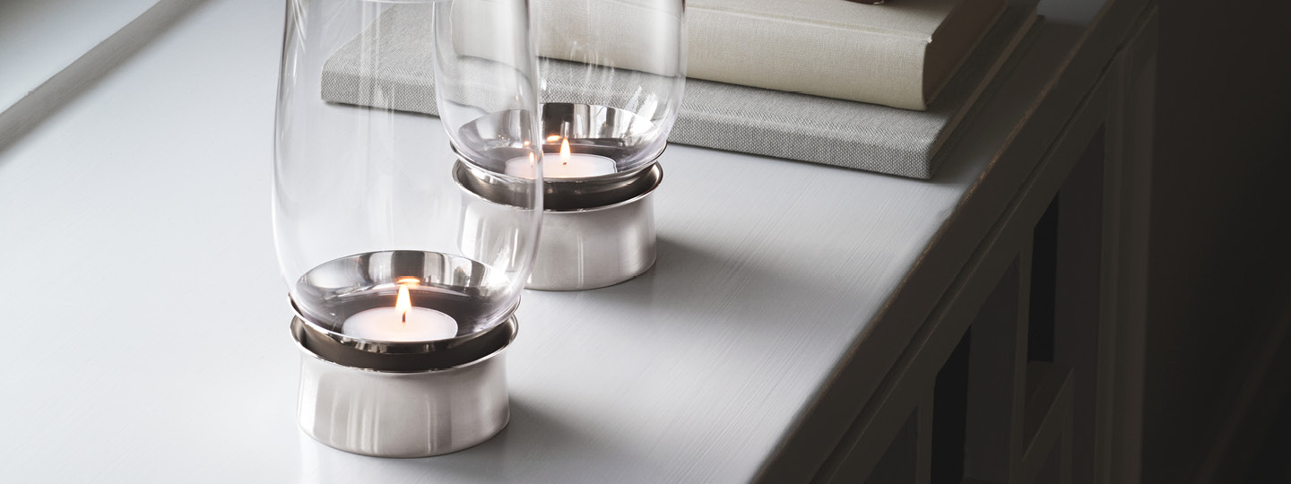 Lumis hurricane collection Danish design tealight candleholder from mouth-blown glass and stainless steel by Georg Jensen  