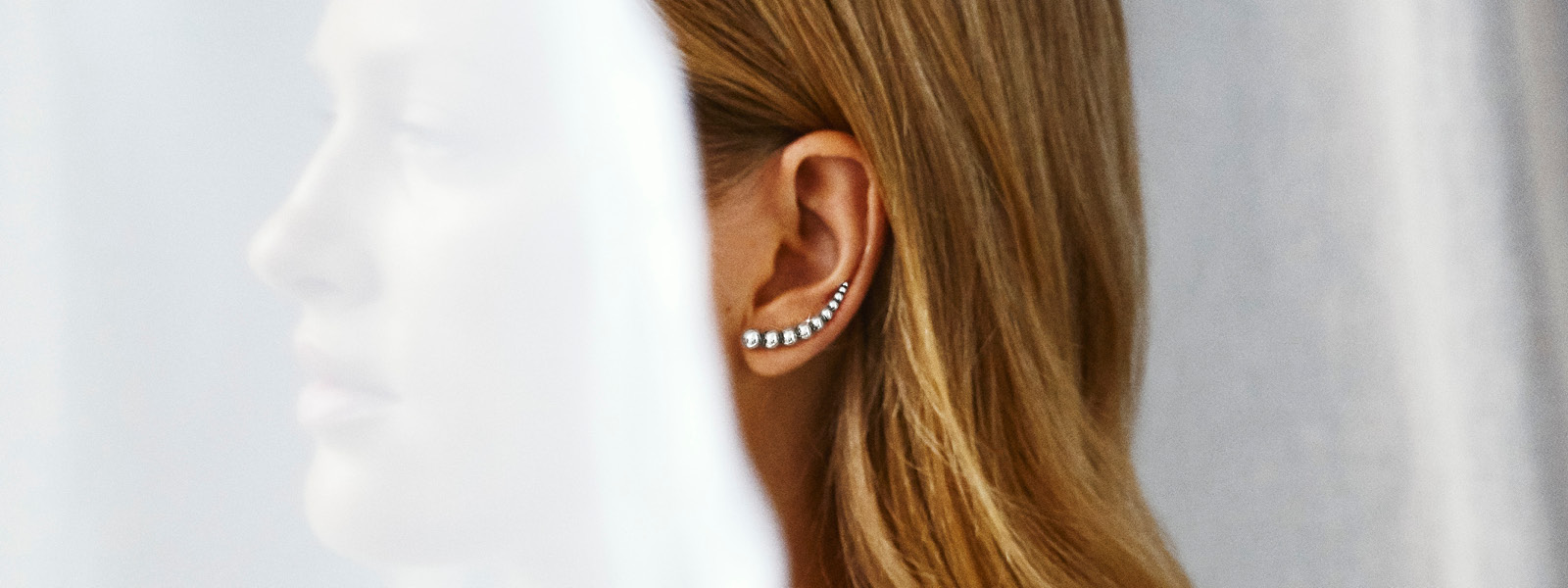 Sterling Silver earstuds on model from the Moonlight Grapes collection designed by Georg Jensen
