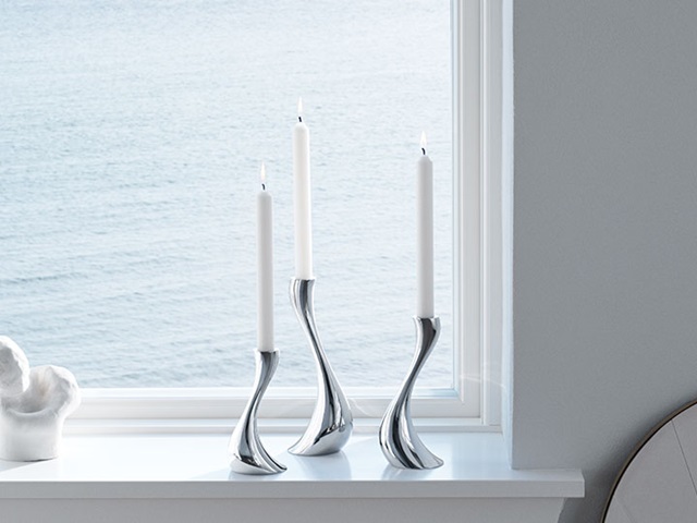Georg Jensen Cobra candle holders in polished stainless steel in size small, medium and large designed by Constantin Wortmann