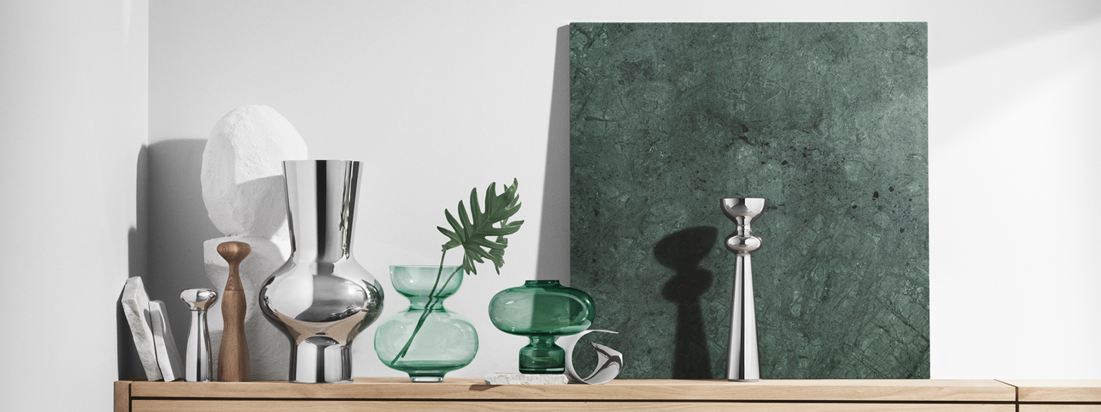 Stainless Steel and mouth blown coloured glass vases from the Alfredo collection designed by Alfredo Häberli at Georg Jensen