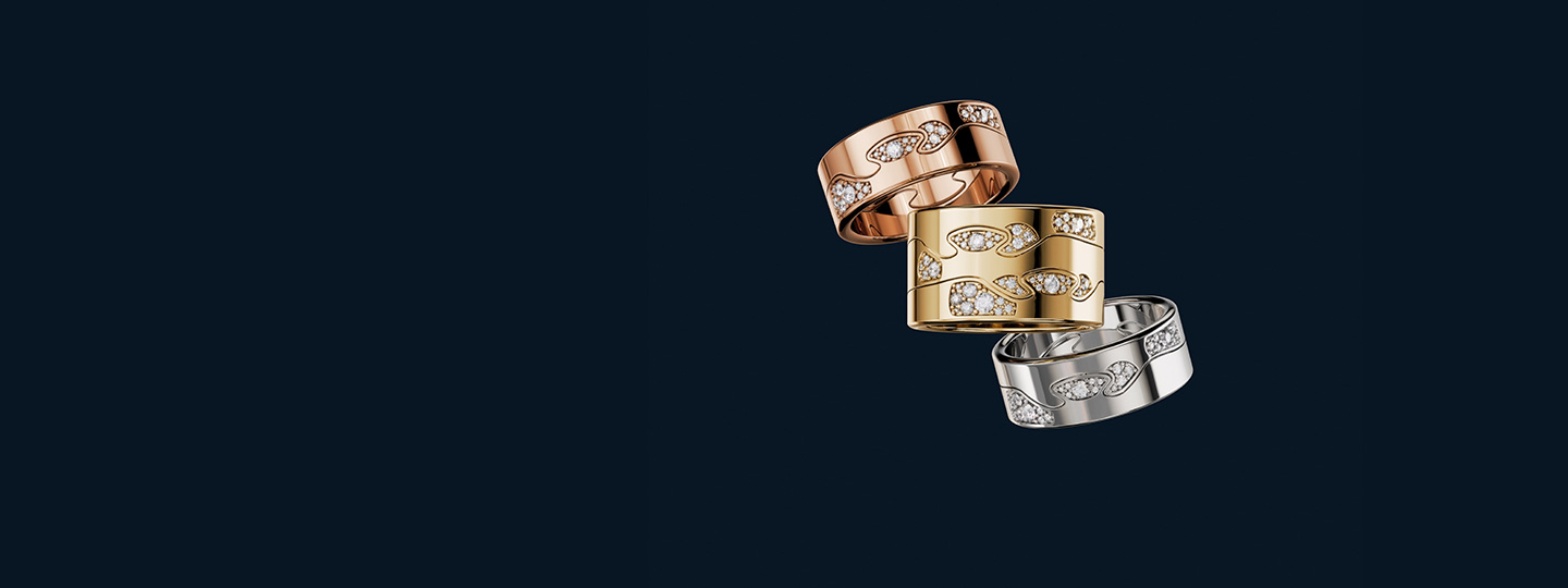 Fusion cloud rings in yellow, rose and white gold 18 karat with diamonds in navy background designed by Nina Koppel for Georg Jensen 