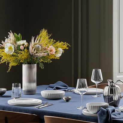 Tablesetting with crystal clear glasses and ceramic plates and bowls from the Bernadotte 2021 line extension
