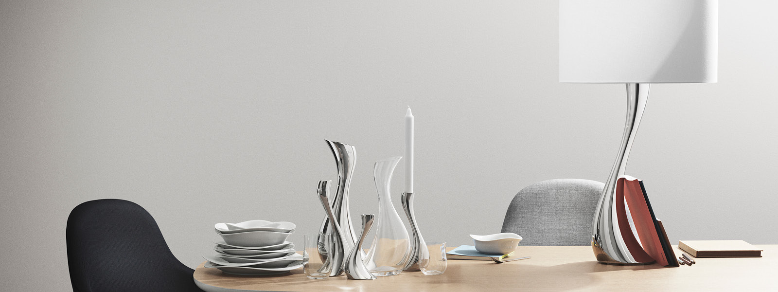 Ceramic plates, crystal cleer glass carafe and mirror polished stainless steel candleholders from the Cobra collection