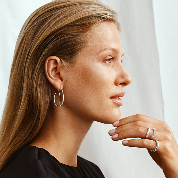 On model image with earring and rings in Sterling Silver with diamonds from the Offspring collection designed by Jacqueline Rabun