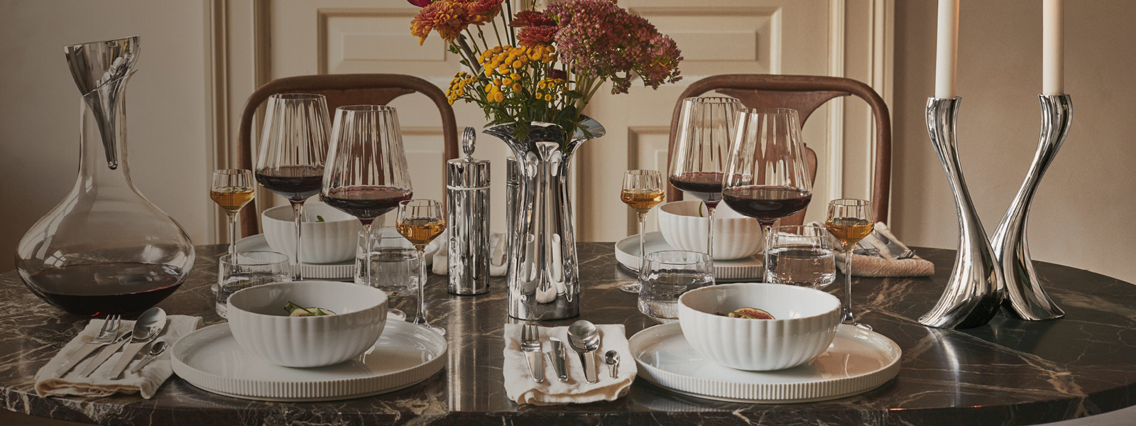 Bernadotte collection tablesetting in porcelain, mirror polished stainless steel and glass inspired by Sigvard Bernadotte