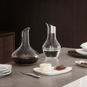 Wine caraf, serving boards and cheese knife from the Sky collection by Georg Jensen