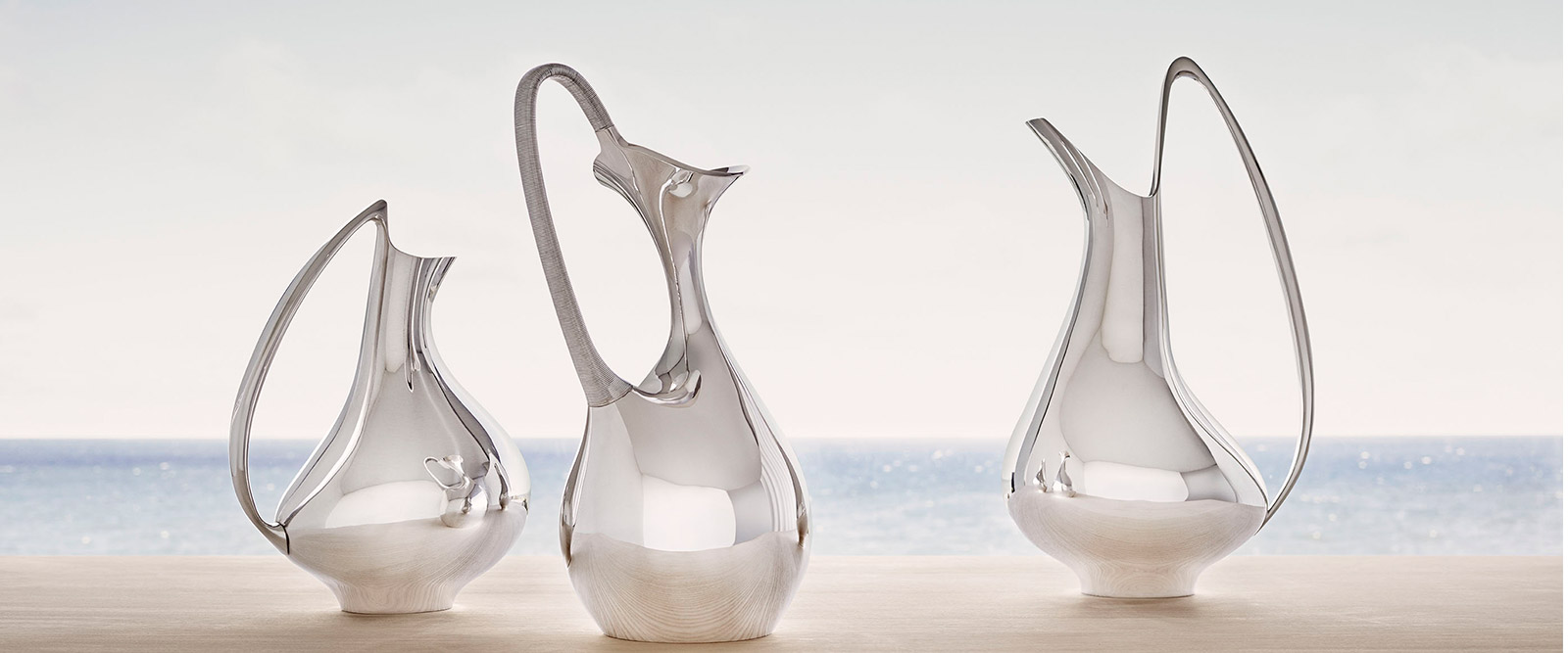 Fine Silverware pitchers in sterling silver designed by Hening Koppel