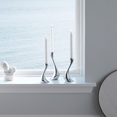 Set of three mirror polished stainless steel candleholders in Scandinavian design from Georg Jensen Cobra collection