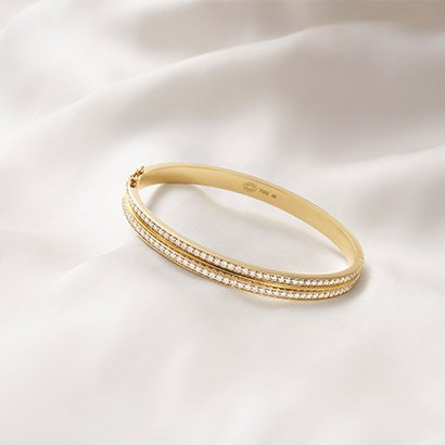 Georg Jensen Scandinavian design Halo collection bangle in 18kt.  yellow gold with white diamonds by Sophie Bille Brahe 