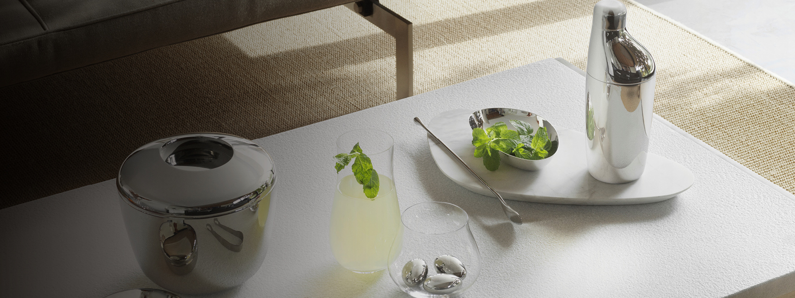 Shiny stainless steel cocktail shaker, icebucket, and glassware inspired by Aurélien Barbry