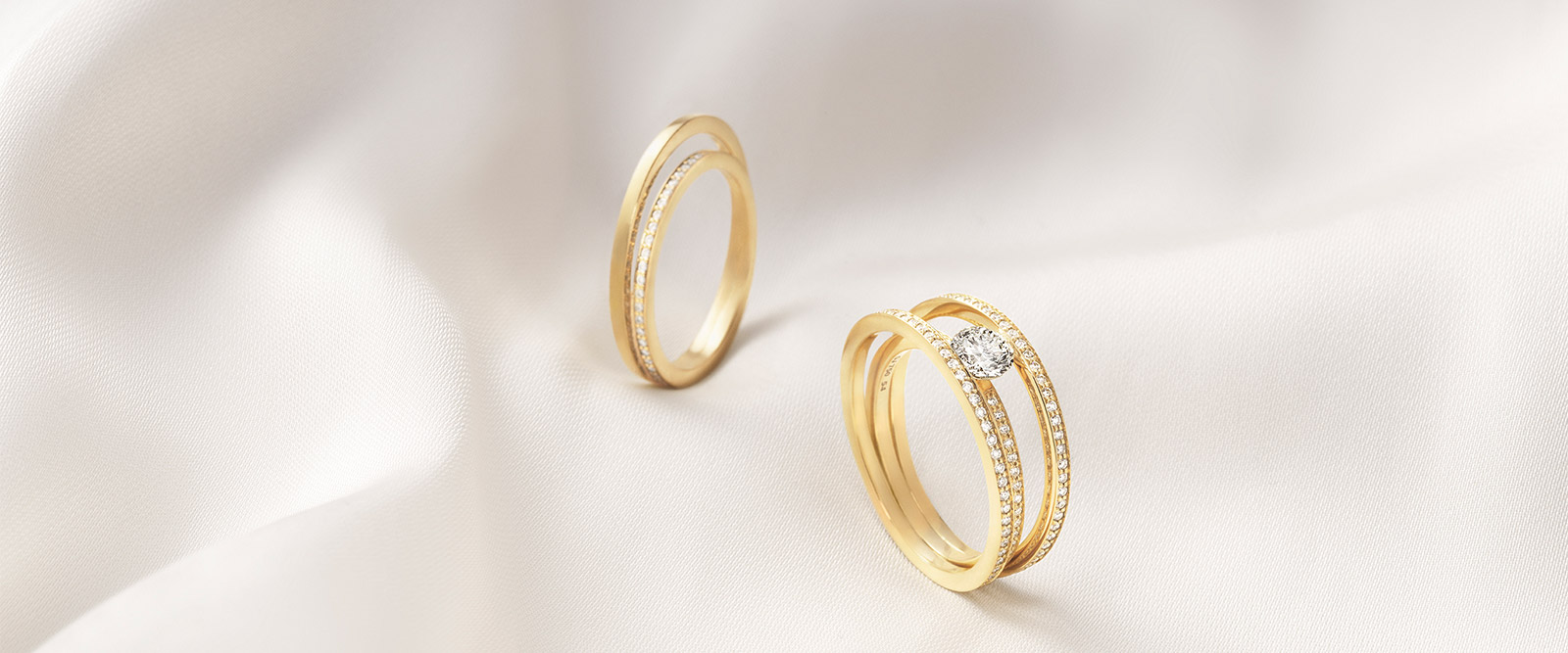 Georg Jensen Scandinavian design Halo collection rings in 18kt. yellow gold with white diamonds one of them solitaire ring