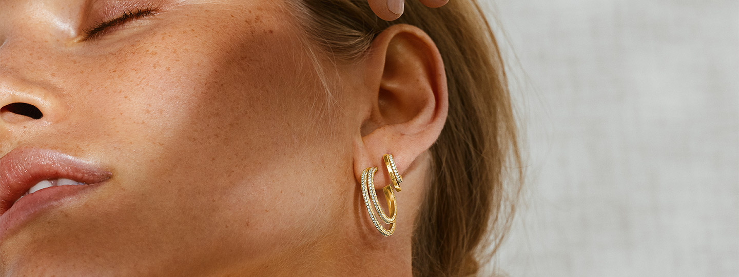 Earrings in 18 kt. gold with diamonds on model from the Halo collection designed by Sophie Bille Brahe