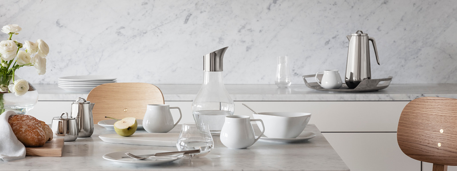 Plates, cups and pitcher form the Sky collection by Georg Jensen