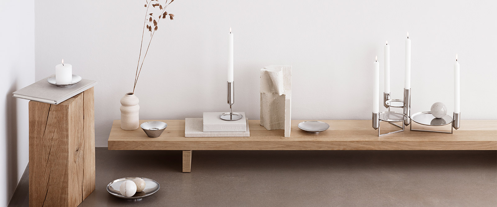 Candleholders and bowls in polished stainless steel from the Tunes collection designed by Monica Förster