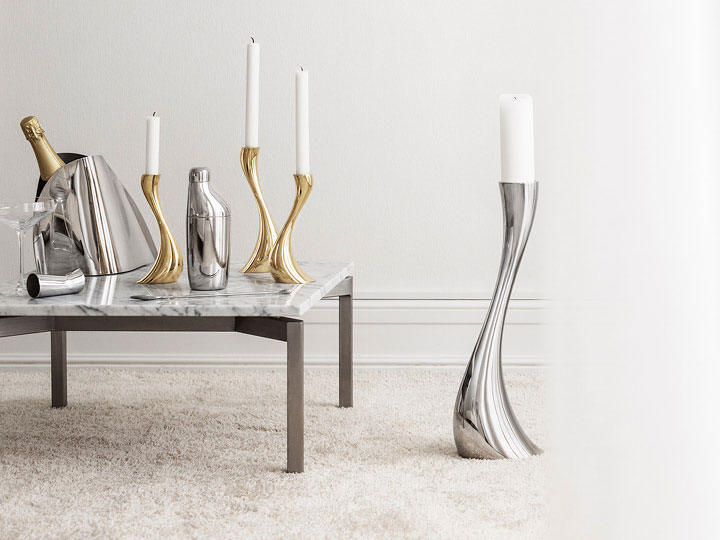 Cobra candleholders and floor candleholders (mirror-polished stainless steel and gold plated) and SKY cocktail shaker, jigger and stirring spoon (mirror-polished stainless steel) and Indulgence champagne cooler 