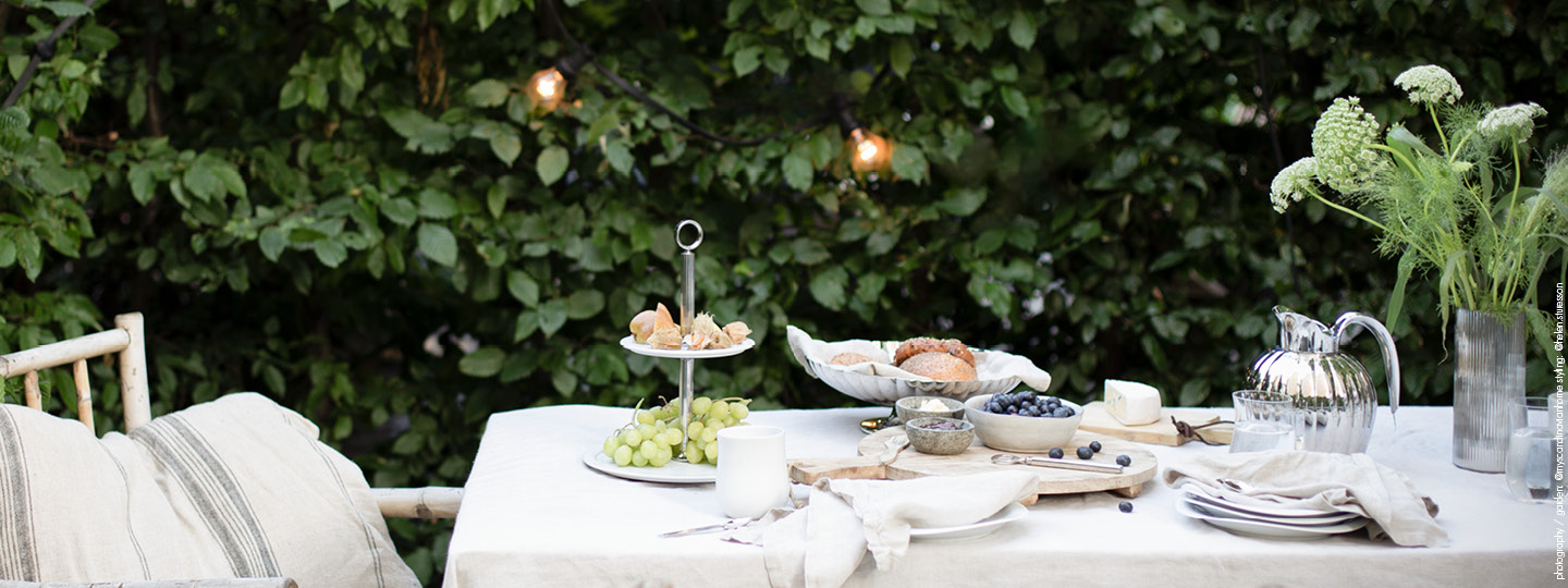 Mirror polished stainless steel and porcelain outdoor tablesetting featuring Bernadotte and Cobra collection