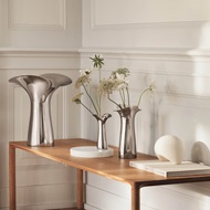 Bloom and Botanica collection Scandinavian home design mirror polished stainless steel large medium small vases Georg Jensen 