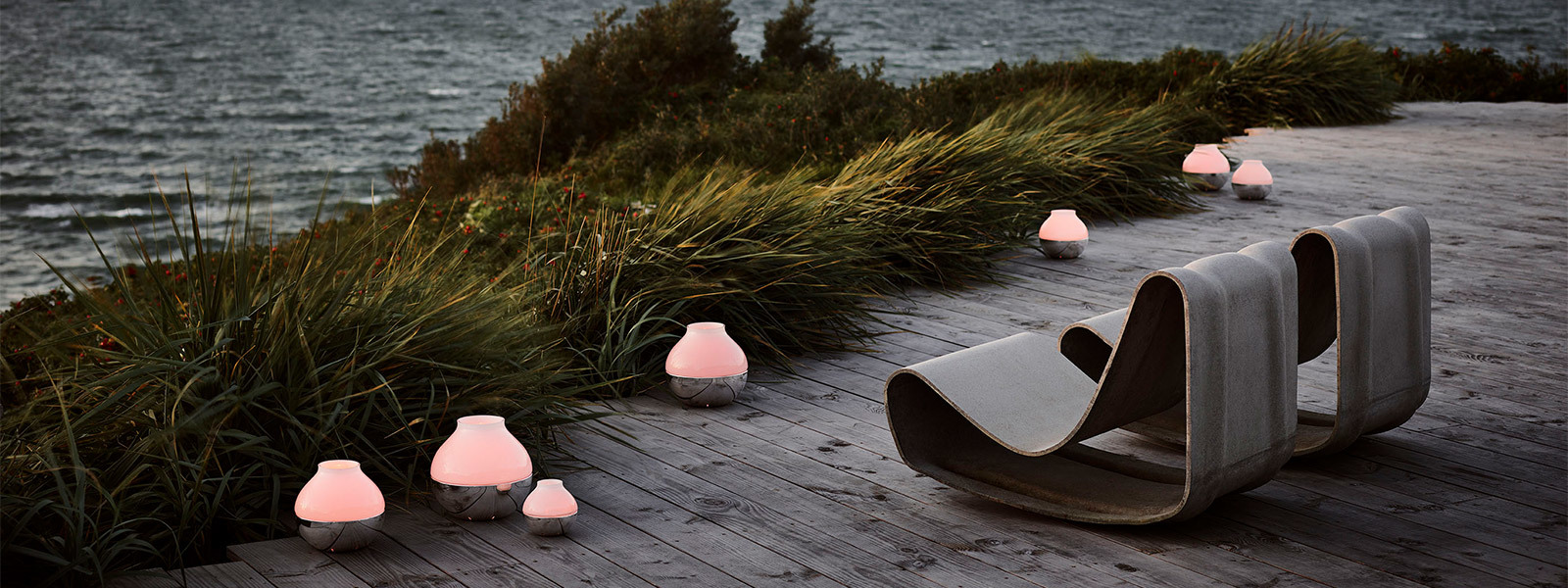 Mirror polished stainless steel and frosted glass candleholders from the Hurricane collection inspired by Henning Koppel