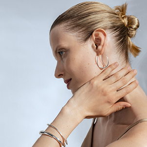 Offspring silver earrings and bracelets designed by Georg Jensen