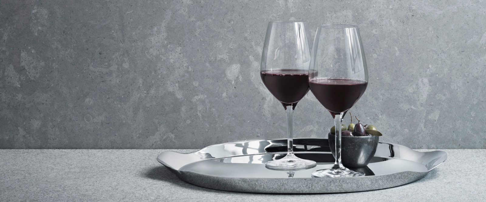 Serving tray in mirror polished stainless steel from the Wine & Bar collection designed by Thomas Sandell