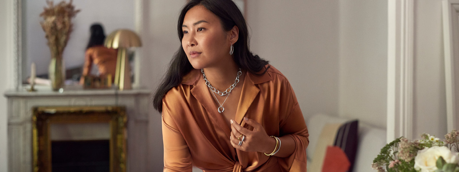 Sterling silver Mercy collection necklace and 18 kt gold rings on Jiawa Lu for Art of Style campaign by Georg Jensen 2022