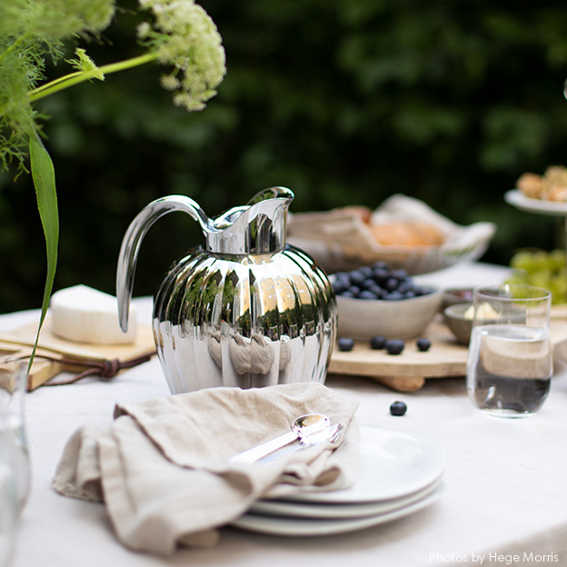 A summer table with Bernadotte table items designed by Georg Jensen