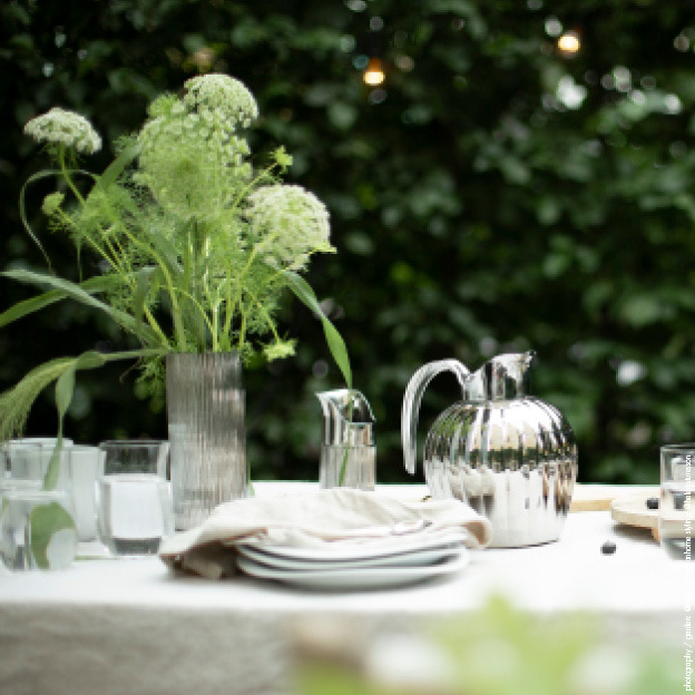 A summer table with Bernadotte table items designed by Georg Jensen