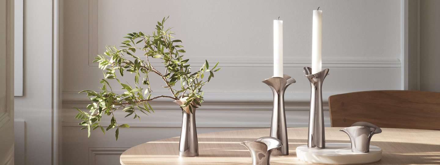 Bloom and Botanica collection Danish design mirror polished stainless steel tealight candleholders and vase by Georg Jensen