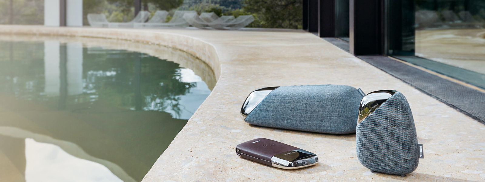 Georg Jensen X Philips collaboration with speakers in stainless steel and blue Kvadrat fabric