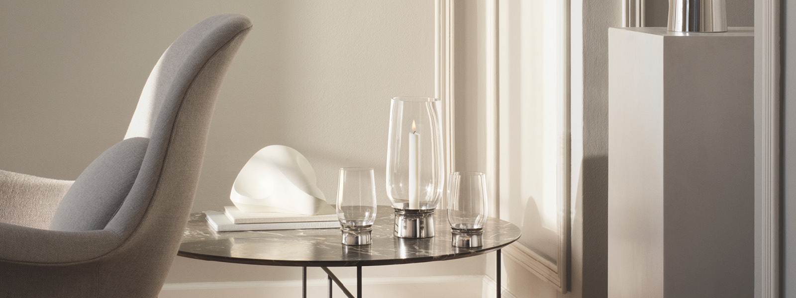 Scandinavian home decor candleholders in medium large size and tealight candleholder from Lumis collection of Georg Jensen