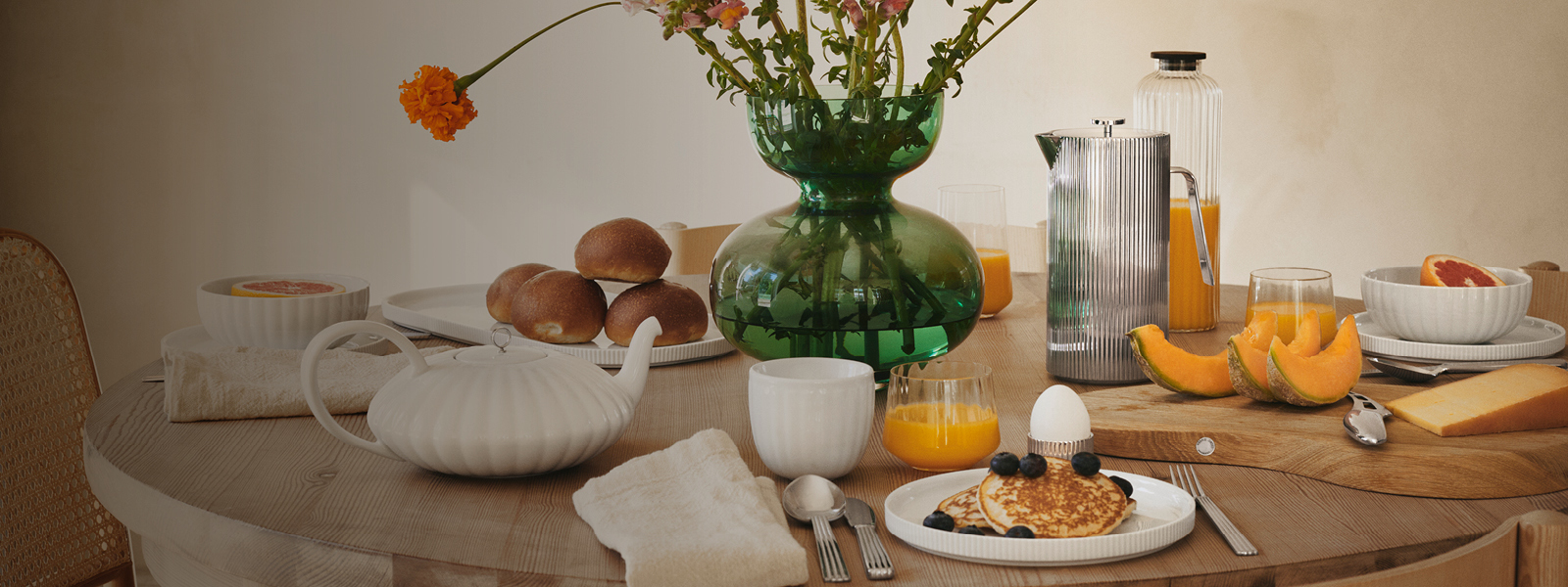 Tableware in glass and white porcelain from the Sky collection by Georg Jensen