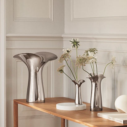 Bloom and Botanica collection Scandinavian home design mirror polished stainless steel large medium small vases Georg Jensen