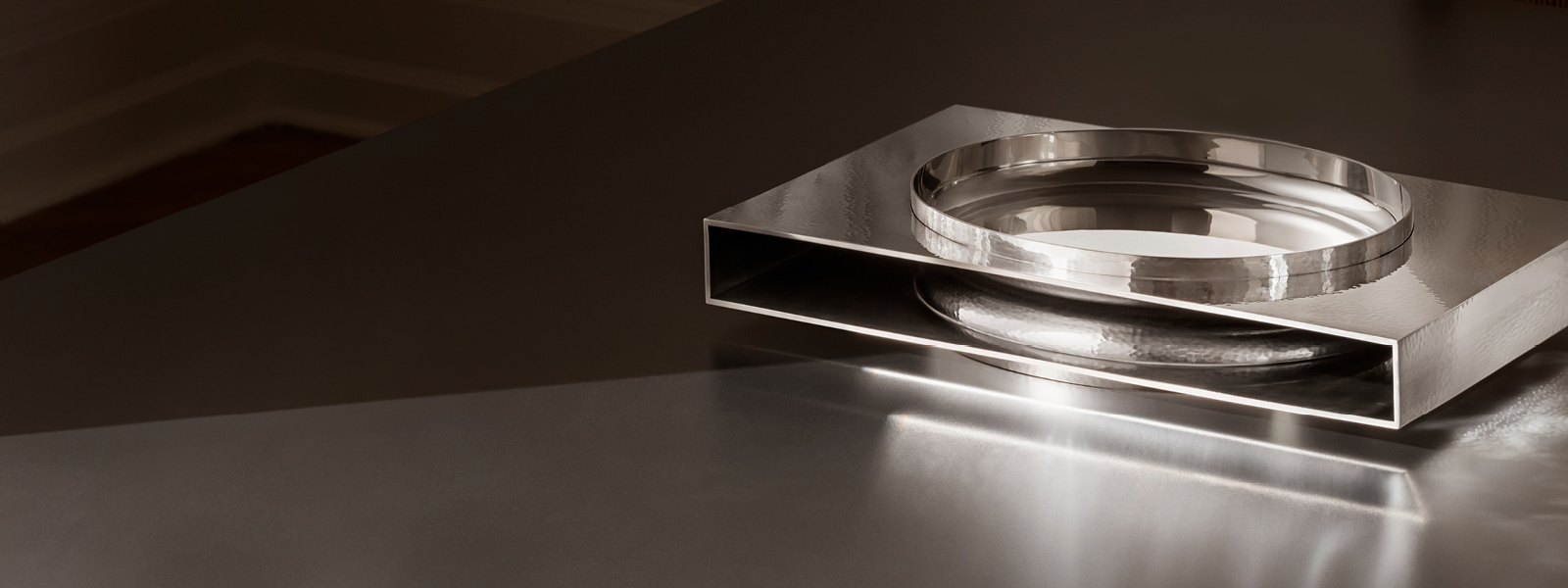 Penumbra is crafted and hammered in sterling silver by Georg Jensen silversmiths and designed by David Thulstrup