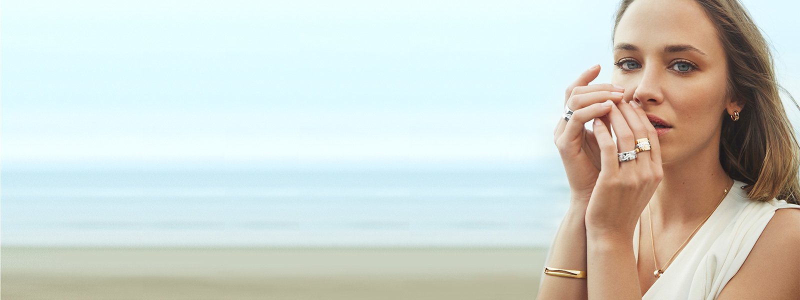 18 kt. gold, sterling silver and diamonds necklace, bangle, earrings and rings on model from the Fusion collection inspired by Nina Koppel