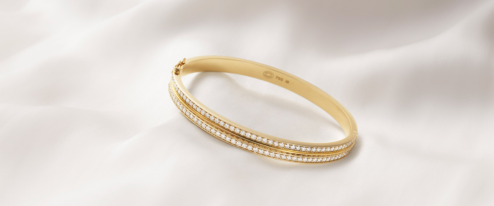 Georg Jensen Scandinavian design Halo collection bangle in 18kt. yellow gold with white diamonds by Sophie Bille Brahe