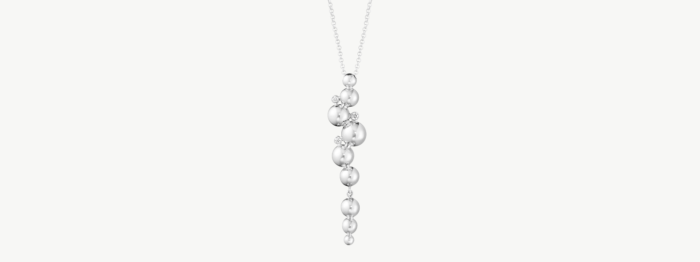 Packshop image of white gold necklace with pendant from the Moonlight Grapes collection by Georg Jensen