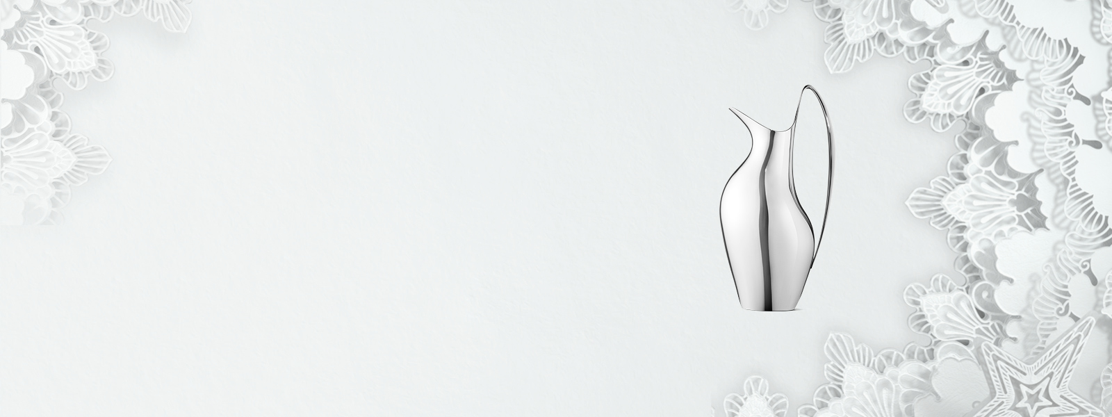Christmas 2021 campaign banner featuring mirror polished stainless steel Koppel pitcher designed by Henning Koppel