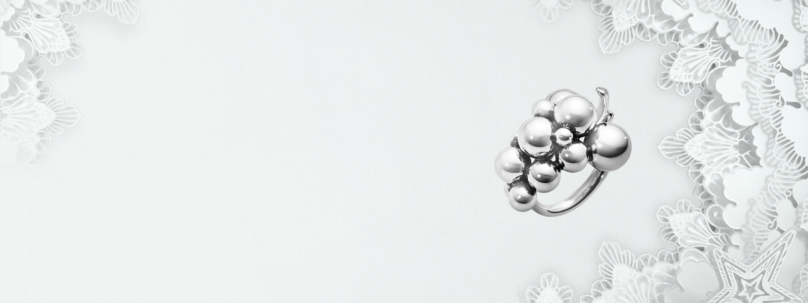 Fine oxidized sterling silver grapes shaped ring from the Moonlight Grapes collection designed by Georg Jensen