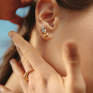 18 kt. yellow and white gold and diamonds grapes inspired earrings and ring on model from the Moonlight Grapes collection