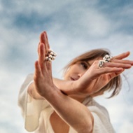 Oxidized sterling silver grapes inspired rings on model from the Moonlight Grapes collection by Georg Jensen