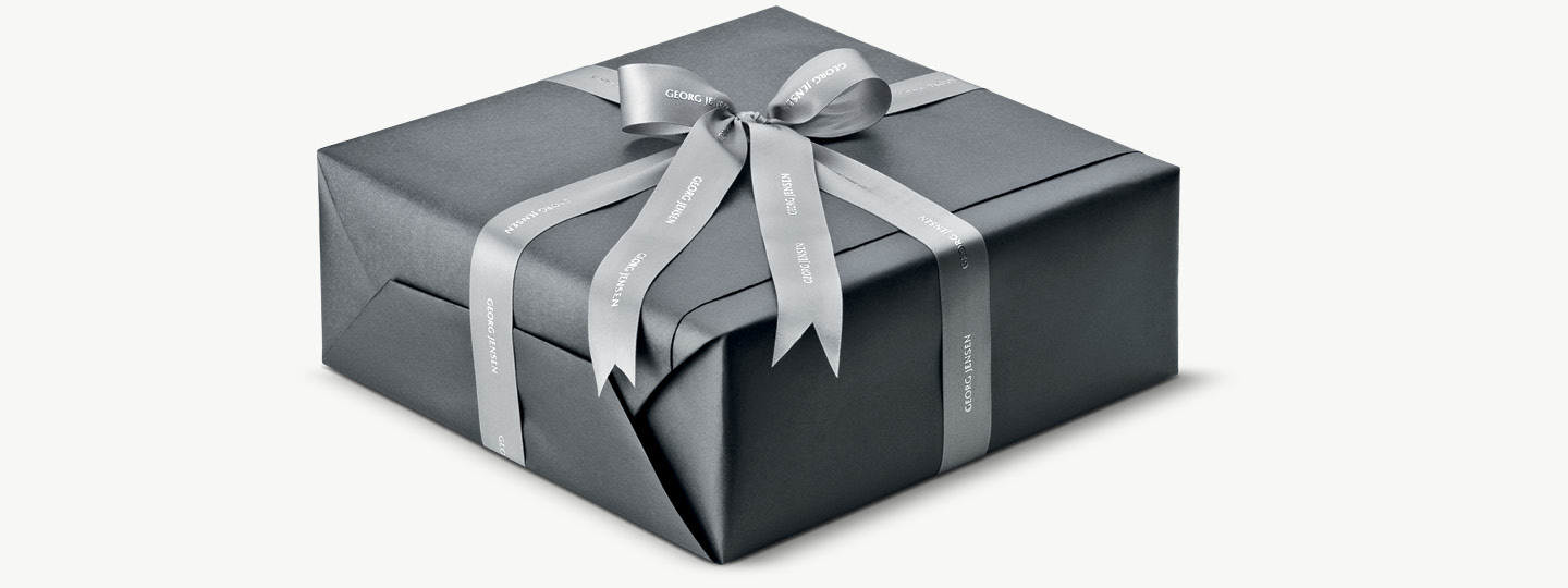 An example of a Georg Jensen present, gift wrapped with gift ribbons the Georg Jensen way