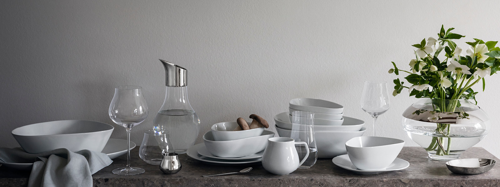 Tableware in glass and white porcelain from the Sky collection by Georg Jensen