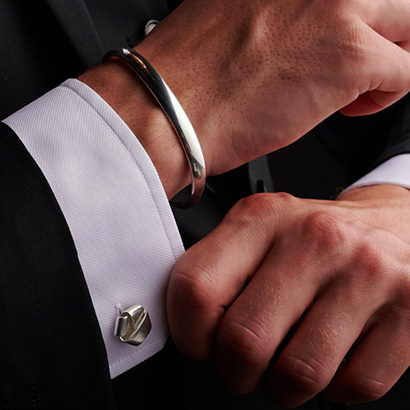 cufflinks in sterling silver mens jewellery on white shirt and men classic bangle in sterling silver on male model from Georg Jensen