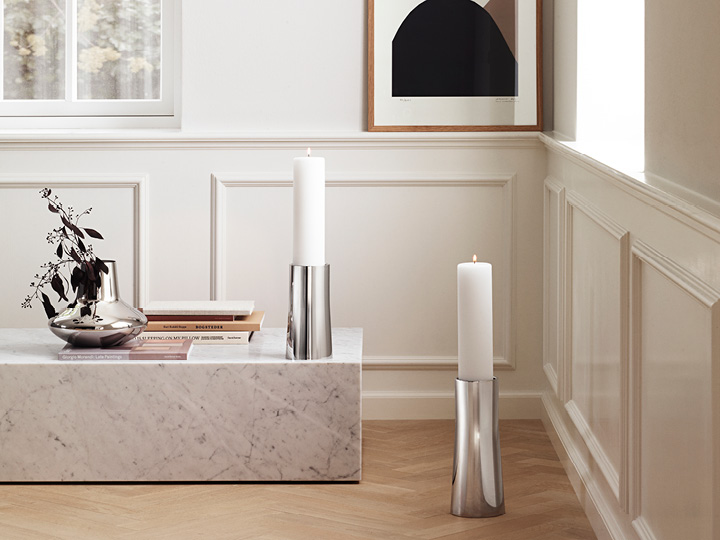Ambience Candle Holders in mirror polished stainless steel in small and large. Koppel Vase in mirror polished stainless steel.