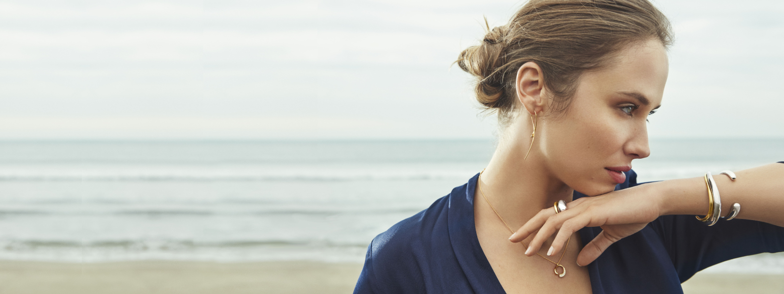 On model image of 18 kt. gold, sterling silver and diamonds jewellery pieces from the Mercy collection designed by Regitze Overgaard