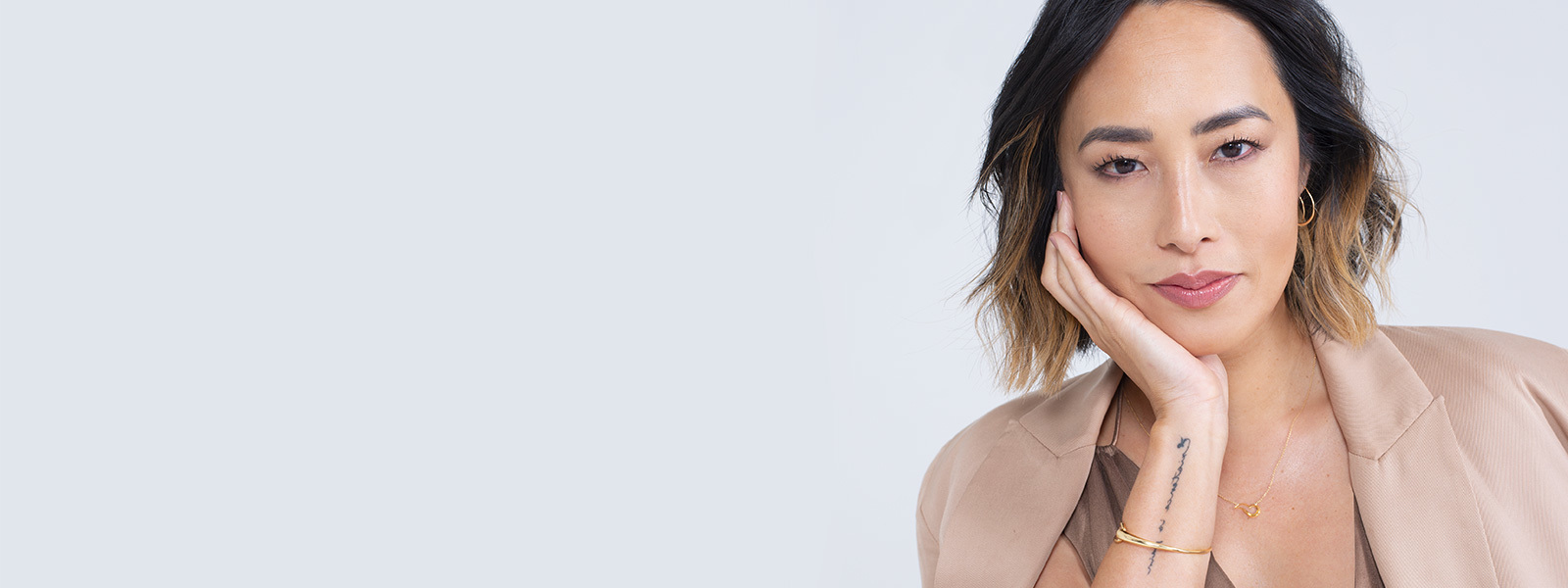 ocrf heart charity pendant, offspring earhoops and mercy bangle in 18 karat yellow gold on melissa leong for OCRF campaign in partnership with georg jensen
