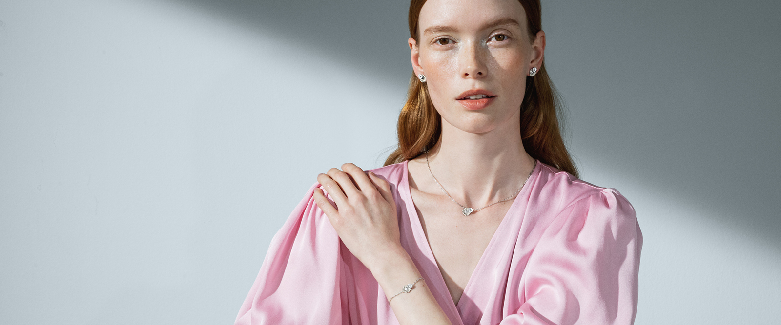 Model wearing sterling silver necklace bracelet and earrings from the new Daisy collection with Stine Goya